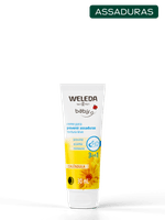 Weleda-Baby-Creme-para-Assaduras-de-Calendula-em-bisnaga-branca-com-tag-verde-de--Assaduras--sobre-fundo-claro-acinzentado.